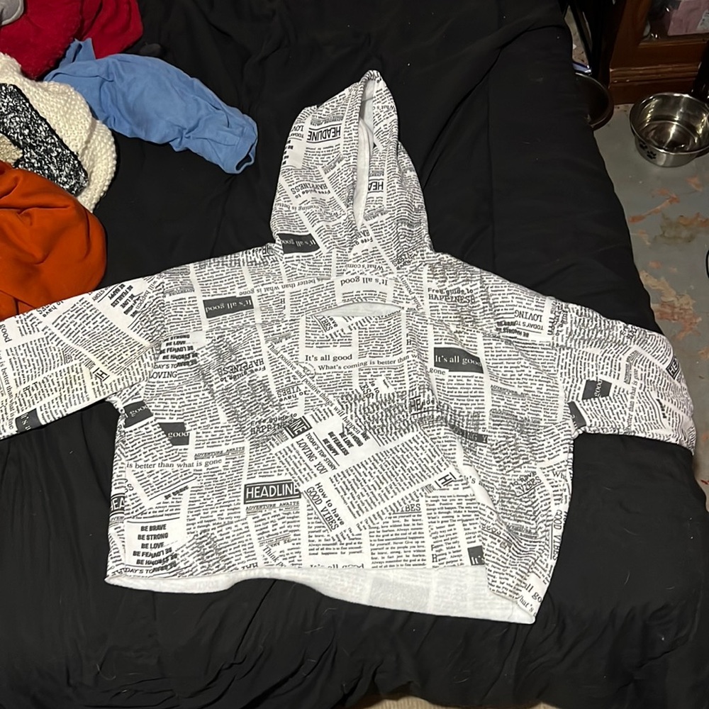 Cropped news letter sweater
